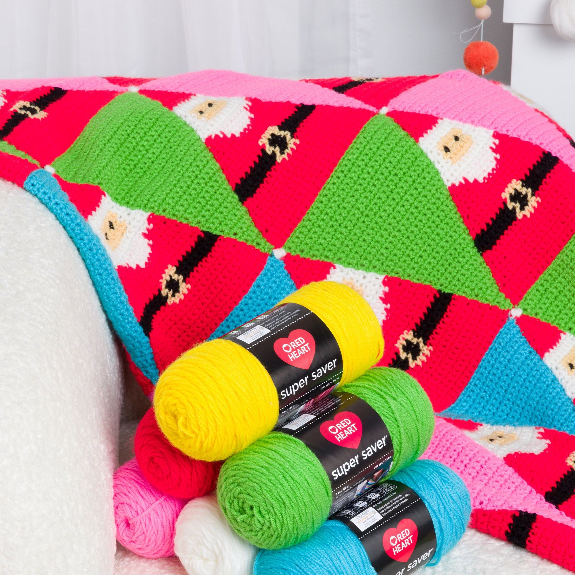 Free Red Heart Santa's Coming to Town Crochet Blanket Pattern
